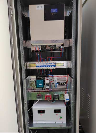 Inside a cabinet: hybrid inverter, protection and battery monitor